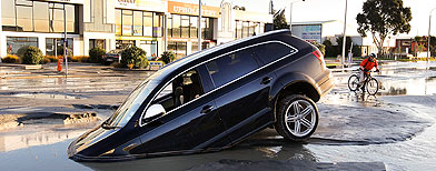 A car stands in water on Ferry Road after two magnitude 6.0 and 5.5 earthquakes struck on June 13, 2011 in Christchurch, New Zealand. The aftershocks have followed four months after the major eathquake which hit the city on February 22, 2011 resulting in the deaths of 181 people. (Photo by Martin Hunter/Getty Images)