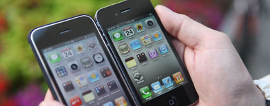 Piotr Kubiak of Oakland, Ill., shows off his new iPhone 4, right, next to his old iPhone outside of an Apple store Thursday, June 24, 2010, in Chicago. (AP Photo/Kiichiro Sato)