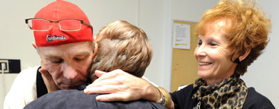 In this Oct. 3, 2011 file photo, Mark Lindquist, of Joplin, Mo., is embraced by his sisters Vehrlene Crosswhite, left, and Linda Baldwin just before being released from the Missouri Rehabilitation Center in Mount Vernon, Mo. (AP Photo/The Joplin Globe, T. Rob Brown, File)