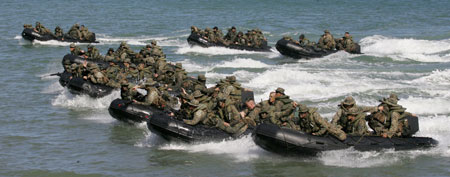 U.S. Marines from the 31st Marine Expeditionary Unit (MEU) of the 3rd Marine Expeditionary Forces and their Philippine counterpart approach a beach in Palawan in southwestern Philippines to simulate an amphibious assault of a hostile area during an amphibious landing exercise in this Oct. 23, 2006, file photo. (AP Photo/Bullit Marquez, FILE)