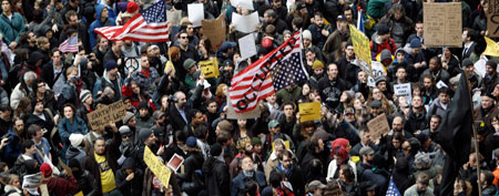 Demonstrators affiliated with the Occupy Wall Street movement assemble across the street from Zuccotti Park before marching through the streets of the financial district, Thursday, Nov. 17, 2011 in New York. (AP Photo/Mary Altaffer)