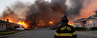 A massive fire roars through a mostly residential neighborhood in San Bruno, Calif (AP Photo/Jeff Chiu)