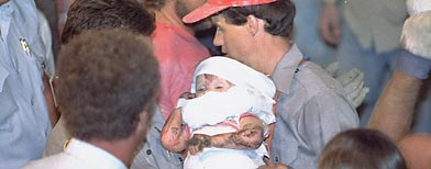 Eighteen-month old Jessica McClure is rescued on Oct. 16, 1987 after she was trapped 22 feet under ground in an abandoned water well. (AP/Eric Gay)