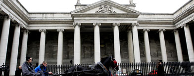 A horse and cart passes the Bank of Ireland in central Dublin (AP)
