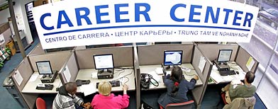 Job seekers search for jobs at WorkSource Oregon. (AP Photo/Rick Bowmer)