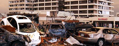 Destroyed vehicles piled up in the parking lot of the Joplin Regional Medical Center. (AP/Mark Schiefelbein)