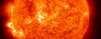 In this handout photo provided by NASA, a Solar and Heliospheric Observatory image shows Region 486 that unleashed a record flare last week (lower left) November 18, 2003 on the sun.  (Photo by NASA via Getty Images)
