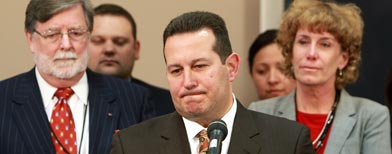 Jose Baez, lead defense counsel for Casey Anthony, pauses while answering questions after his client was found not guilty in
her first-degree murder trial, at the Orange County Courthouse, in Orlando, Fla., Tuesday, July 5, 2011. Looking on are co-counsel Cheney Mason, left, and Dorothy Clay Sims. (AP Photo/Joe Burbank, Pool)