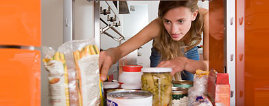 Woman looking in cupboard (Getty Images)