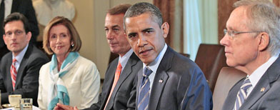 President Barack Obama, flanked by House Speaker John Boehner of Ohio, left, and Senate Majority Leader Harry Reid of Nev., right, meets with Congressional leadership in the Cabinet Room of the White House in Washington, Thursday, July 7, 2011, to discuss the debt. (AP Photo/Pablo Martinez Monsivais)