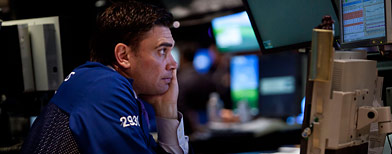 A trader works on the floor of the New York Stock Exchange during afternoon trading on August 3, 2011 in New York City. (Andrew Burton/Getty Images)