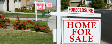 Row of foreclosure homes for sale (Thinkstock)