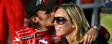 Dan Wheldon kisses his wife Susie as he celebrates. (Photo by Marc Serota/Getty Images)