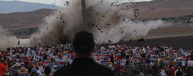 A P-51 Mustang airplane crashes into the edge of the grandstands at the Reno Air show on Friday, Sept. 16, 2011 in Reno Nevada. (AP Photo/Ward Howes)