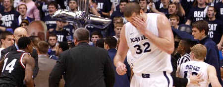 Xavier Musketeers center Kenny Frease (32) holds his eye after being hit by Cincinnati Bearcats forward Yancy Gates (not pictured) at the end of the game at the Cintas Center. The Musketeers defeated the Bearcats 76-53. (Frank Victores-US PRESSWIRE)