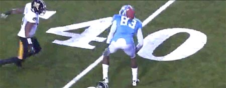 The ball appears stuck on the back of Dwight Jones of North Carolina (Y! Sports screengrab)