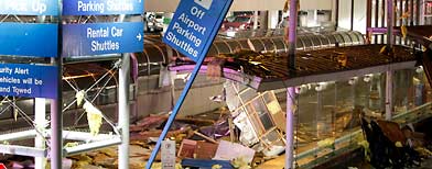 Storm damage is seen outside Terminal 1 at St. Louis International Airport on Friday, April 22, 2011, in St. Louis. (AP Photo/Jeff Roberson)