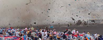 A P-51 Mustang airplane crashes into the edge of the grandstands at the Reno Air show on Friday, Sept. 16, 2011 in Reno Nevada. (AP Photo/Ward Howes)