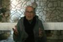 An image grab taken from a video posted on YouTube on January 21, 2014 by local media activists shows Dutch Roman Catholic priest Father Frans der Lugt speaking from Homs