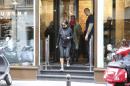 Kim Kardashian and U.S rap singer Kanye West leave a fitness center in Paris, Wednesday, May 21, 2014. The gates of the Chateau de Versailles, once the digs of Louis XIV, will be thrown open to Kim Kardashian, Kanye West and their guests for a private evening this week ahead of their marriage. (AP Photo/Jacques Brinon)