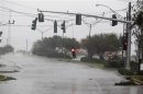 A stop light hangs down as Hurricane Isaac pushes into the New Orleans metro area in Metairie