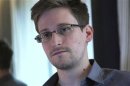 Former U.S. spy agency contractor Edward Snowden is interviewed by The Guardian in his hotel room in Hong Kong