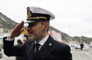 Italian Coast Guard Capt. Gregorio De Falco salutes as he arrives on the Tuscan Island Isola del Giglio, Italy, Sunday, Jan. 13, 2013. De Falco was heard ordering the captain, who had abandoned the ship with his first officers, back on board to oversee the evacuation. But Capt. Francesco Schettino resisted the order, saying it was too dark and the ship was tipping dangerously. Survivors of the Costa Concordia shipwreck and relatives of the 32 people who died marked the first anniversary of the grounding Sunday. (AP Photo/Gregorio Borgia)
