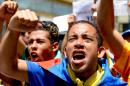 Members of the Venezuelan opposition shout slogans during a march to demand electoral power to activate the recall referendum against President Nicolas Maduro, in Caracas on July 27, 2016