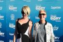 Actress Portia de Rossi (L) and actress Ellen DeGeneres attend the world premiere of Disney-Pixar's "Finding Dory," which made the biggest splash in the North American box office over the weekend, taking in an estimated $73.2 million