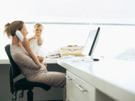 working mother with baby on lap