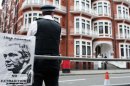 The Metropolitan Police stand outside the Ecuadorian Embassy in London