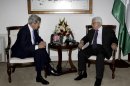 Palestinian President Mahmoud Abbas, right, meets with U.S. Secretary of State John Kerry in the West Bank city of Ramallah Sunday, April 7, 2013. (AP Photo/Mohamed Torokman, Pool)