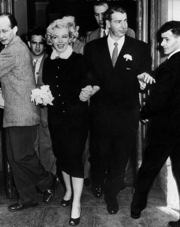 Marilyn Monroe was unique and so was her bridal look. When the world-famous actress married baseball legend Joe DiMaggio at San Francisco City Hall in 1954 she wore a dark suit with mink-fur trim. The