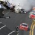 NASCAR driver Tony Stewart avoids a crash to win the NASCAR Nationwide Series DRIVE4COPD 300 race at the Daytona International Speedway in Daytona Beach