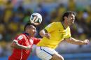 Chile's Gary Medel and Brazil's Fred go for a header during the World Cup round of 16 soccer match between Brazil and Chile at the Mineirao Stadium in Belo Horizonte, Brazil, Saturday, June 28, 2014. (AP Photo/Frank Augstein)