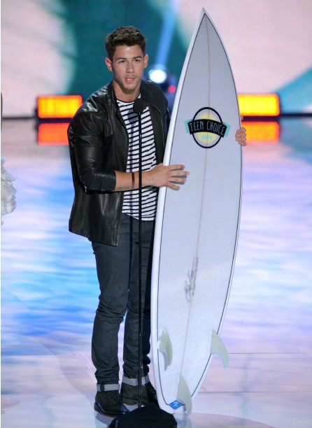 Nick Jonas accepts the inspire award at the Teen Choice Awards at the Gibson Amphitheater on Sunday, Aug. 11, 2013, in Los Angeles. (Photo by John Shearer/Invision/AP)