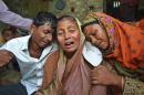 Relatives of people killed when an unidentified gunmen attacked a mosque during evening prayers on Thursday grieve before their funeral in Bangladesh's Bogra district, Friday, Nov. 27, 2015. Thursday's attack follows a wave of deadly assaults in 2015 on foreigners, secular writers and the Shiite community in the country. (AP Photo)
