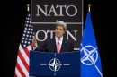 U.S. Secretary of State Kerry gestures during a news conference at the NATO headquarters in Brussels