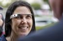 FILE - Cecilia Abadie wears her Google Glass as she talks with her attorney outside of traffic court in this Dec. 3, 2013 file photo taken in San Diego. The California woman believed to be the first cited for wearing Google's computer-in-an-eyeglass while driving says she was within her rights and violated no law. The case to be tried Thursday Jan. 16, 2014 in a San Diego traffic court could help shape future laws on wearable technology as it goes mainstream. (AP Photo/Lenny Ignelzi, File)