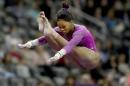 Gabrielle Douglas of the United States competes on the uneven parallel bars during the 2016 AT&T American Cup on March 5, 2016 at Prudential Center in Newark, New Jersey