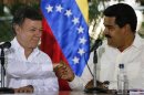 Nicolas Maduro and Juan Manuel Santos attend a news conference in Puerto Ayacucho