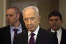 Israeli President, Shimon Peres, arrives to give a brief statement at the World Economic Forum, in Southern Shuneh, 34 miles (55 kilometers) southeast of Amman, Jordan, Sunday, May 26, 2013. Peres says it is possible for Israelis and Palestinians to overcome differences and skepticism over peacemaking and that it is time to restart serious negotiations and conclude a peace treaty that has long dogged the two warring sides. AP Photo/Mohammad Hannon)