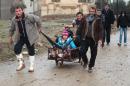Iraqi families flee an area near Mosul controlled by Islamic State group on January 22, 2017