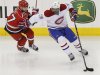 Canadiens' Subban battles Hurricanes' Brent for the puck during their NHL hockey game in Raleigh