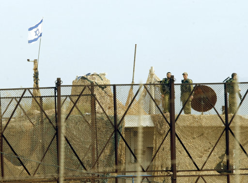 Israeli soldiers are seen on the heavily guarded border with Lebanon
