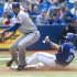 Toronto Blue Jays' Arencibia is out on the force out at third base as Texas Rangers' Garcia makes the play in their American League MLB baseball game in Toronto