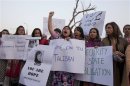 Activists hold pictures of Malala Yousufzai during a demonstration in Islamabad