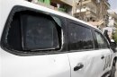 Damaged United Nations vehicle used by members of the U.N. observers mission in Syria, is seen near a hotel in Damascus