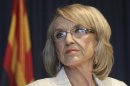 Arizona Governor Jan Brewer listens to a question from a media member about the Supreme Court's decision on SB1070 in Phoenix.