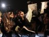 Lady Gaga, second left, signs autographs as she arrives at Vnukovo airport outside Moscow late Monday, Dec. 10, 2012. Lady Gaga, set to perform at Moscow's Olimpiisky stadium on Wednesday. (AP Photo/Pavel Golovkin)